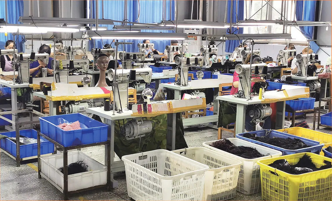 NUSFACE wig production floor with workers at sewing machines